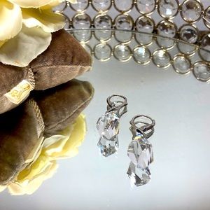 Bright silver and Swarovski earrings.